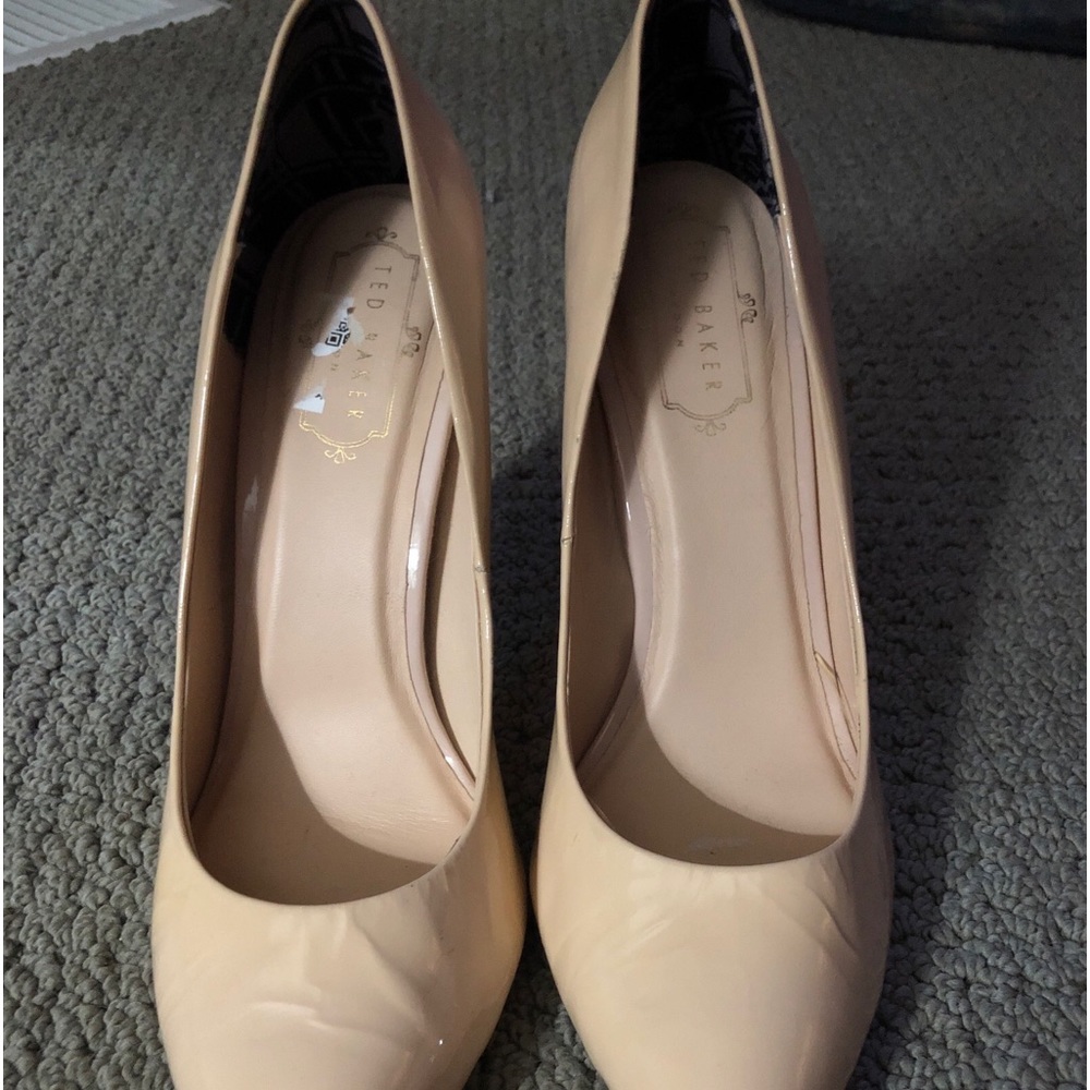 Ted Baker high heel patent leather nude pumps.